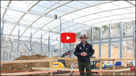 Bob inside new Giraffe Center building during a Bob's Blueprints video