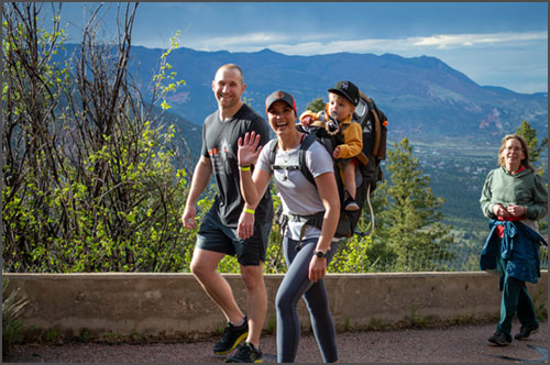 Run to the Shrine participants on the course above Cheyenne Mountain Zoo, Colorado Springs city views below.
