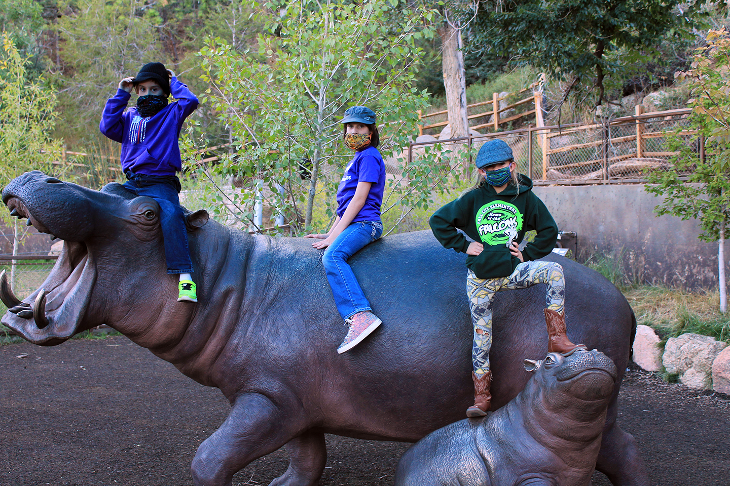 Kids on hippo sculptures at starlight safari evening
